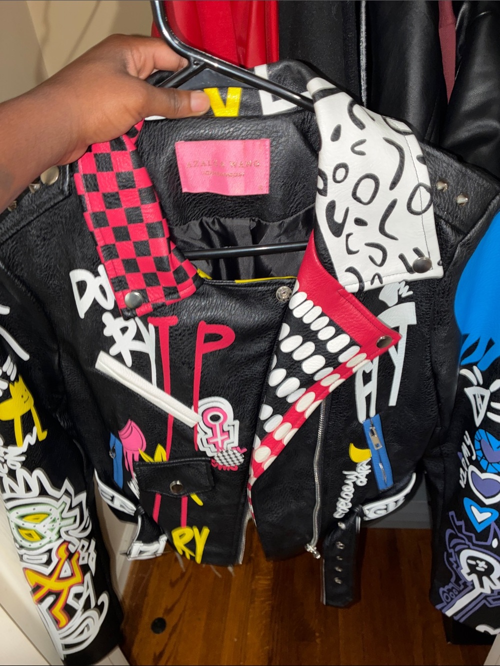Black Graphic Faux Leather Biker Jacket with Pink and White Accents